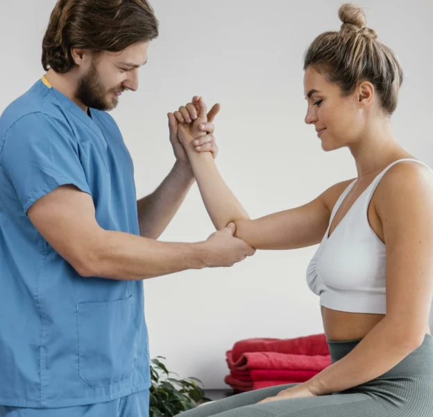 side-view-male-osteopathic-therapist-checking-female-patient-s-elbow-scaled