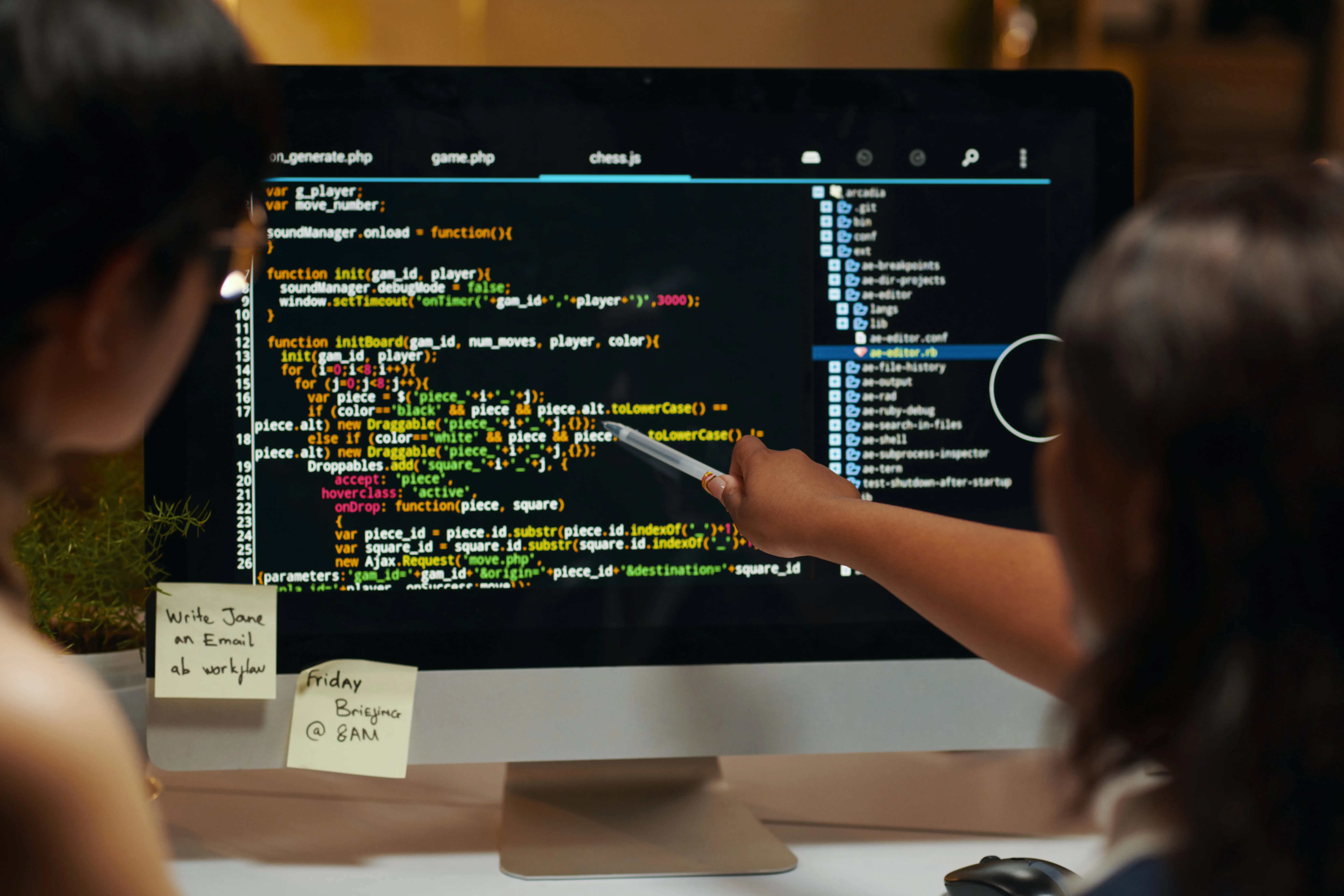 developers pointing at programming code 2024 06 21 23 54 29 utc 1 1